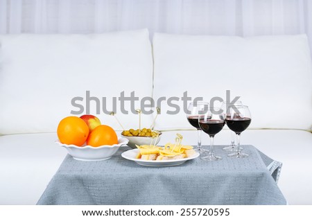 Table at home with food and drinks for friends