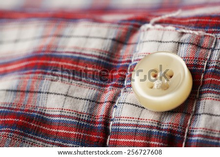 Button on clothes close up