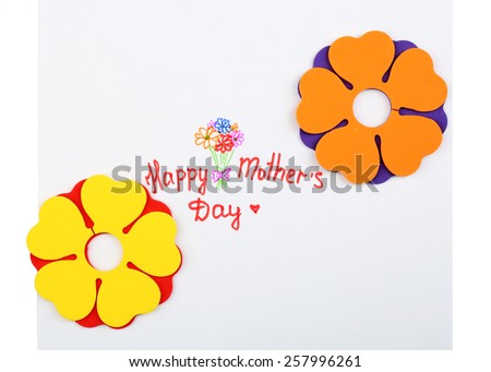 Happy Mothers Day message written on paper and decorative flowers isolated on white