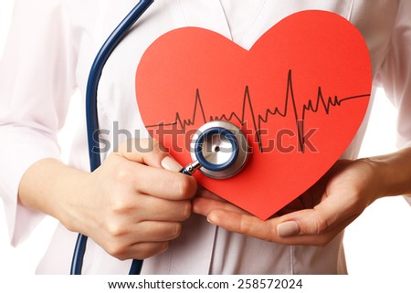 Doctor hands with heart and stethoscope on white background. closeup