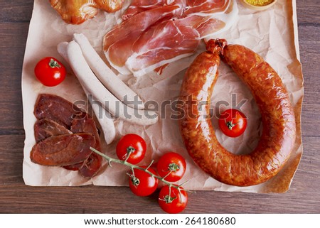 Assortment of deli meats on parchment, top view