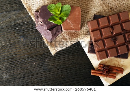 Still life with set of chocolate on table, top view