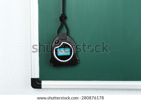 Sport timer on blackboard background
