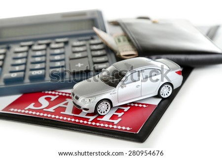 Tablet, calculator and toy car isolated on white