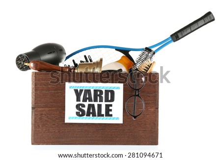 Box of unwanted stuff ready for yard sale isolated on white
