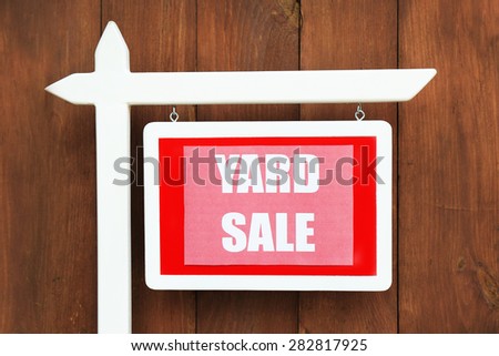 Wooden Yard Sale sign on wooden fence background