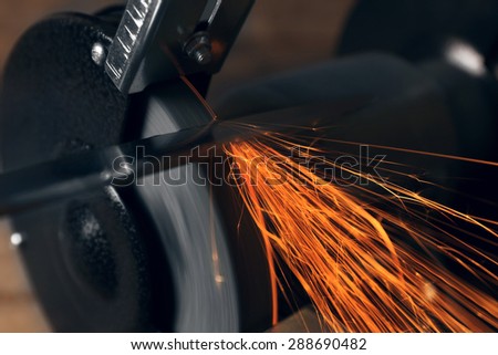 Knife sharpener on wooden table, closeup