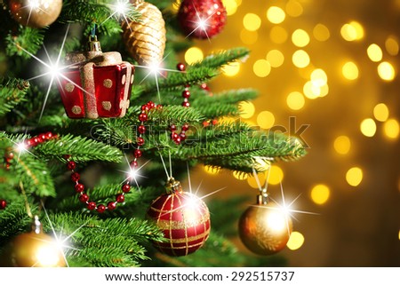 Decorated Christmas tree on lights background