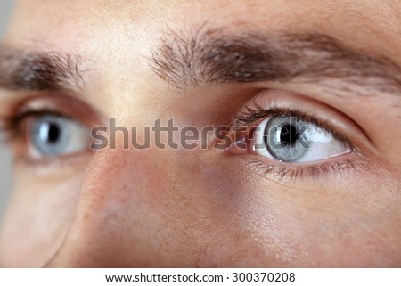 Beautiful blue man eyes close up