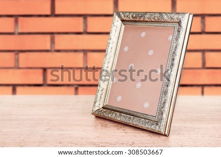 Old frame on brick wall background