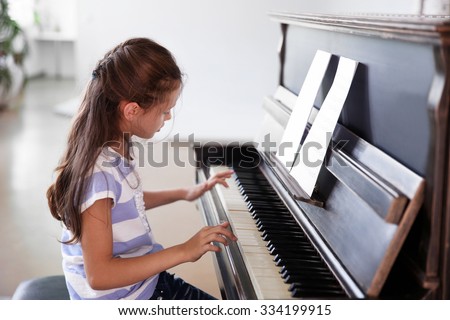 Similar – Image, Stock Photo Child practicing piano