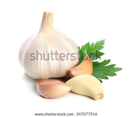 Garlic with leaves of parsley isolated on white Сток-фото © 