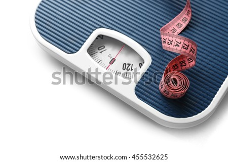 Bathroom scale with measuring tape on white background. Weight loss concept Stock foto © 