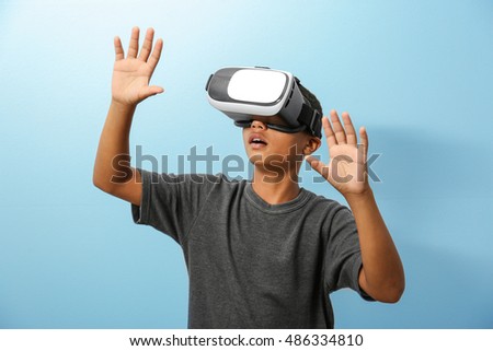 Similar – Image, Stock Photo Boy with virtual reality glasses on colorful background. Future technology, VR concept