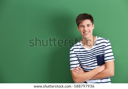 Similar – Image, Stock Photo young happy boy teenager standing in front of the camera in posed portrait