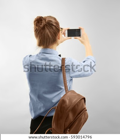 Similar – Image, Stock Photo Female tourist taking shot of sea in twilight
