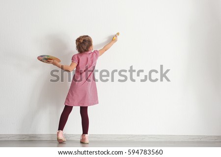 Similar – Image, Stock Photo Child paints with a crayon on a white sheet of paper