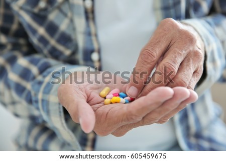 Similar – Image, Stock Photo Senior man taking prescription medicine at home