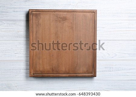 Similar – Image, Stock Photo Empty wooden square cutting board on black table, food display template