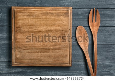 Similar – Image, Stock Photo Empty wooden square cutting board on black table, food display template