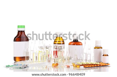 Medical bottles with syringe, medical ampoules and tablets isolated on white