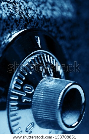 Combination lock. Dark blue colorized. Shallow DOF. Safety concept.