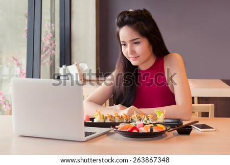 girl with laptop in japan restaurant