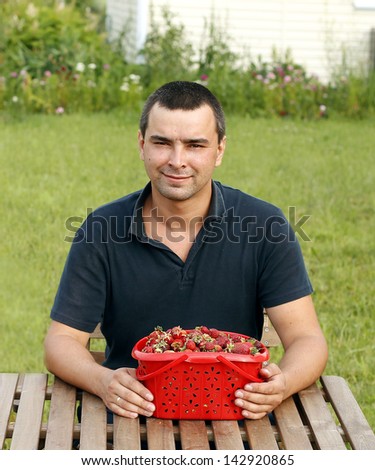 Man eating strawberry