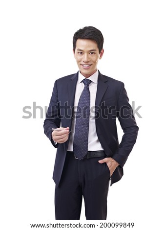 young asian businessman standing with pen in hand, isolated on white.