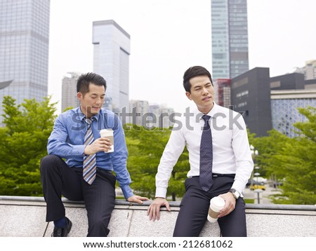 asian business executives having a bad day.