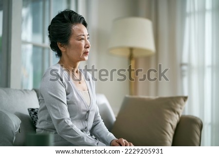 Similar – Image, Stock Photo Senior woman sitting alone on the sofa at home