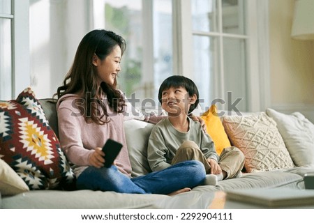Similar – Image, Stock Photo Mother and son crossing a bridge together