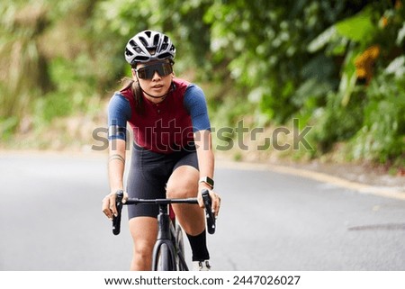 Similar – Image, Stock Photo Cyclist riding bike on rural road in highlands