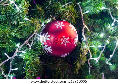 Christmas tree ornaments on a small piece of art is believed to be a replica of the fruit. Most have bright colors.