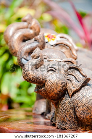 Smiling elephant: elephants bringing the animal symbol of Thailand. Statues made to feel happy smile.