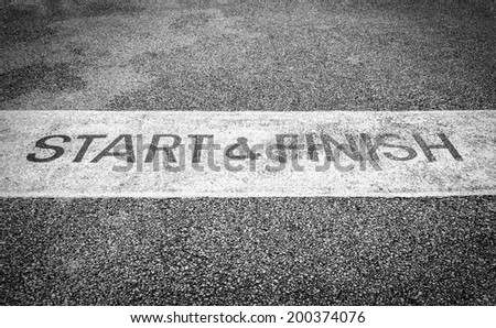 Black and white street start and finish line.