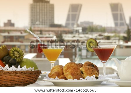 Breakfast in a terrace of Madrid Hotel with buildings in the background