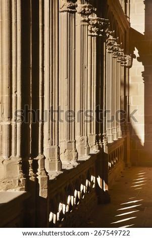 Romanesque columns with shadows at sunset in Navarra, Spain. Vertical