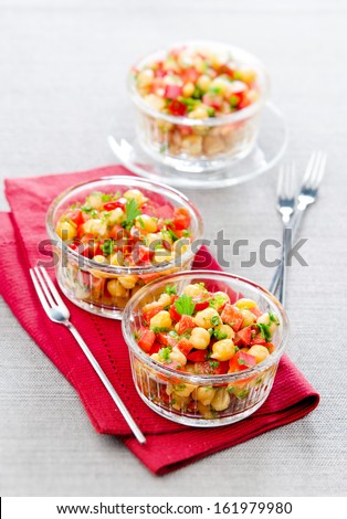 Chickpea salad in glass salad bowls