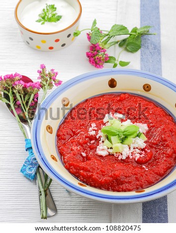 Cold vegetable soup with beet, cucumber, and cheese