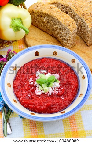 Cold vegetable soup with beet, cucumber, and cheese