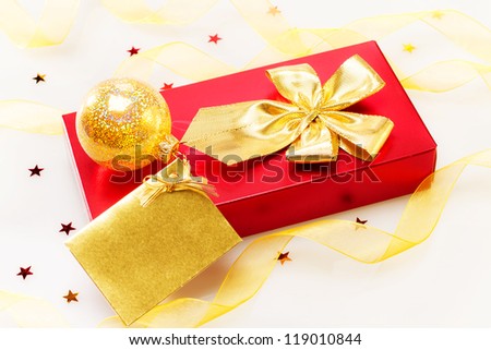 Red Gift box with gold ribbon and gift card