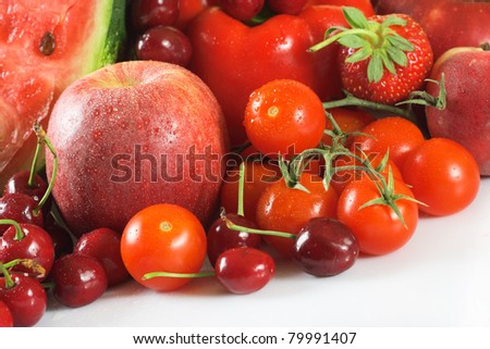 Red fresh group of fruits and vegetables for a balanced diet.