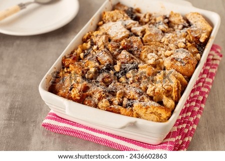 Similar – Image, Stock Photo Sweet bread pudding with orange zest butter