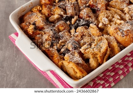 Similar – Image, Stock Photo Sweet bread pudding with orange zest butter