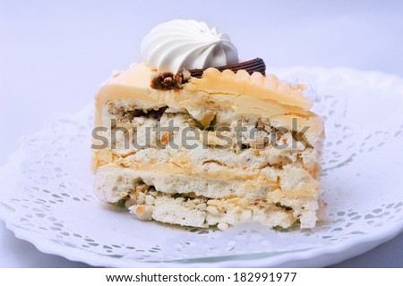 Meringue cake with nuts and cream