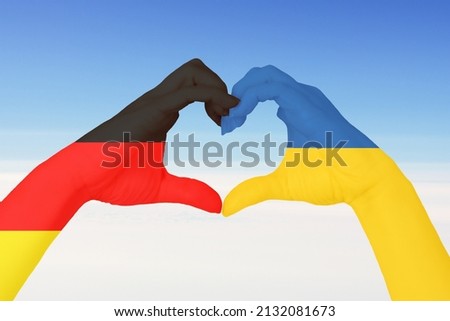 Ukraine war with Russia, Germany support, help, peace, hands Ukrainian and German flags in the form of a heart, love to Ukrainians Foto stock © 