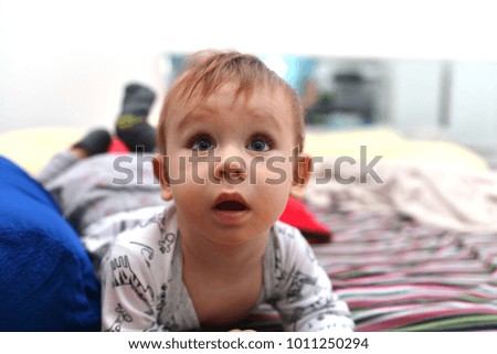 Similar – Image, Stock Photo Perplexed baby staring into the camera