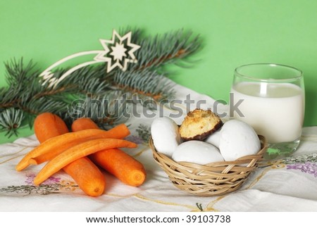 Christmas refreshment is carrot for reindeer and milk with biscuits for Santa Claus