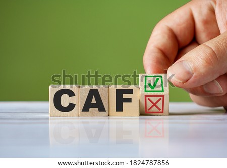 The hand turn wooden block with red reject X and green confirm tick as change concept of CAF. Word CAF conceptual symbol. Photo stock © 